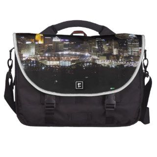 Cincinnat skyline with the moon above laptop bags