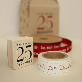 'do not open until the 25th dec…' paper tape by ella james