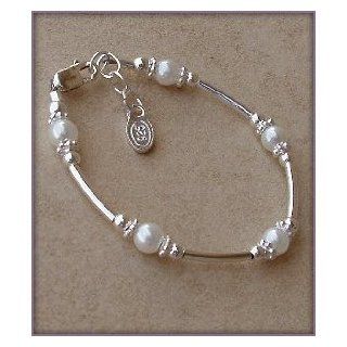 Madelyn Sterling Silver Childrens Girls Bracelet Jewelry This unique sterling silver bracelet is made with silver curved tubes and beautiful white Czech pearls accented by sparkling silver daisies on either side   a dainty and delicate touch! Size Medium 1