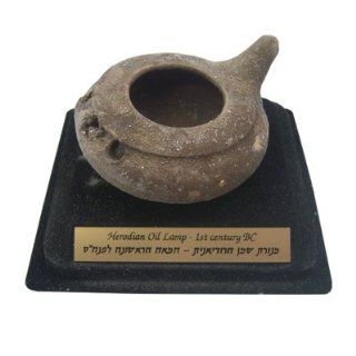 Ancient Treasures From the Land of Israel. Herodian Oil Lamp Replica. Comes With Plaque and Stand. Hand Made in Israel. First Century BC. Includes Information Booklet. Size: 3.75" X 2". Great Gift for Yom Kippur Rosh Hashanah Shabbat Purim Sokot 